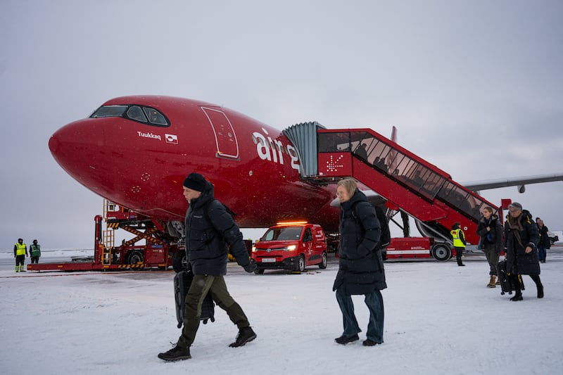 Passengers disembark from an Air Greenland flight arriving from Copenhagen at Nuuk Airport. Photograph: Jonathan Nackstrand/AFP via Getty Images