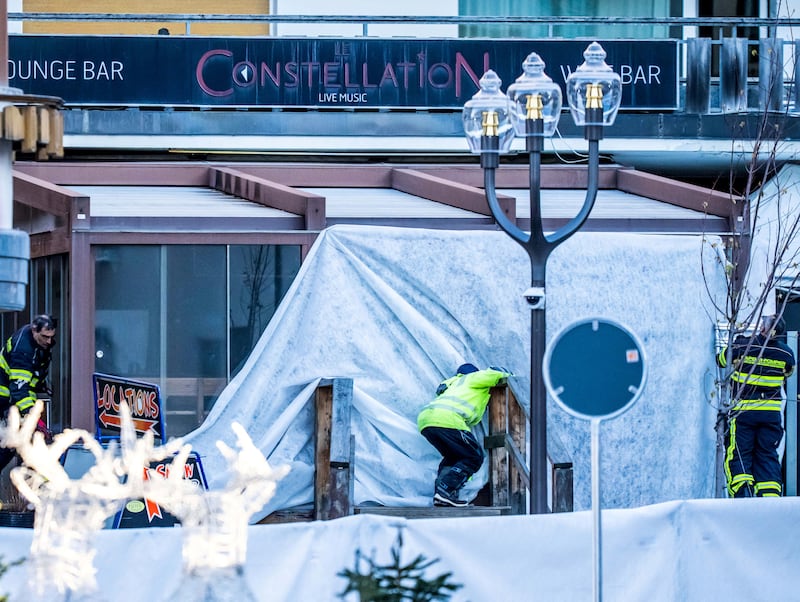 Rescuers and firefighters work at the site of an explosion that ripped through a bar in Crans-Montana. Photograph: MAXIME SCHMID/AFP via Getty Images