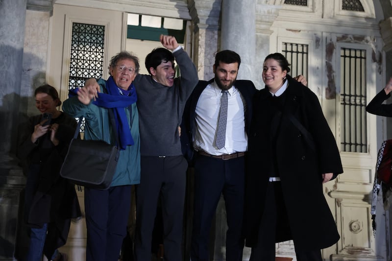 Seán Binder (second left), Pieter Wittenberg, Nasos Karakitsos and Sarah Mardini leave the courthouse in Mytilene on the Greek island of Lesbos on Thursday. Photograph: Manolis Lagoutaris/AFP/Getty