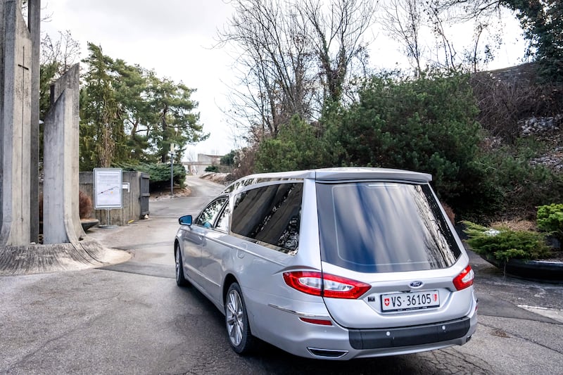 A hearse arrives at the funeral home in Sion. Photograph: Maxime Schmid/AFP via Getty