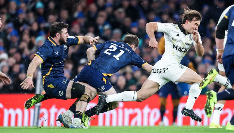 Leinster's Luke McGrath and Robbie Henshaw try to grab hold of La Rochelle's Nathan Bollengier during Saturday's Champions Cup encounter. Photograph: Nick Elliott/Inpho