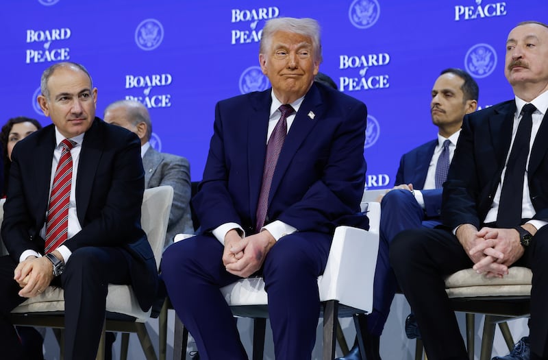 Us president Donald Trump sits in between Armenian prime minister Nikol Pashinyan (left) and Azerbaijan's president, Ilham Aliyev, during a signing ceremony for the 'Board of Peace' in Davos. Photograph: Chip Somodevilla/Getty Images