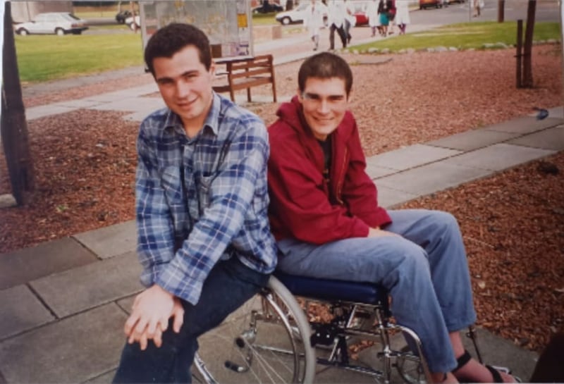 Harry and Liam in outside the Glasgow hospital where Liam was cared for, a few months after he became ill in 1993