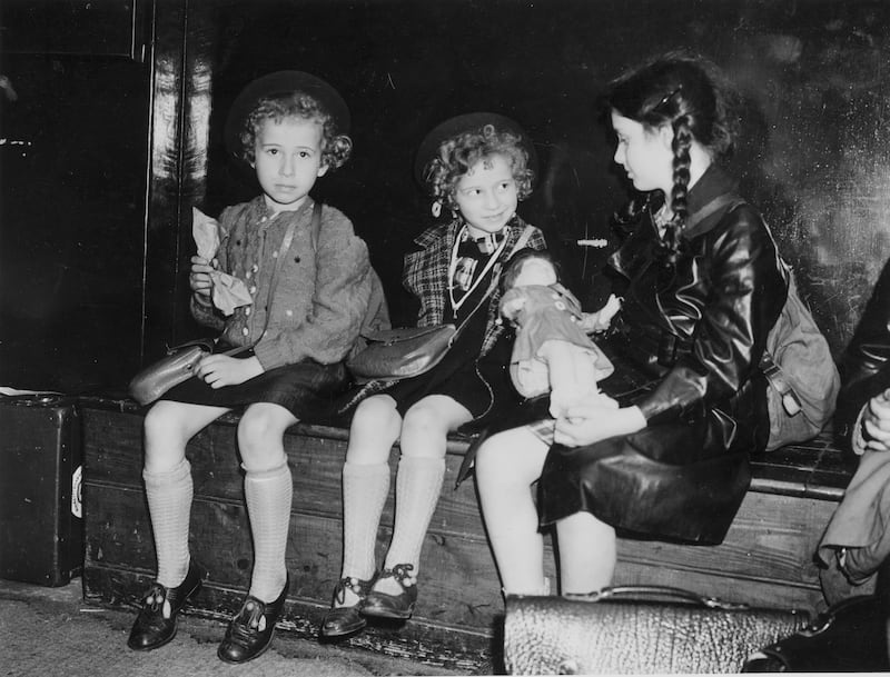 Three Jewish refugee children from Nazi Germany, waiting to be collected by their relatives or sponsors at Liverpool Street Station, London, after arriving by special train on the Kindertransport programme, July 5th 1939. Photograph: Stephenson/Topical Press Agency/Hulton Archive/Getty Images