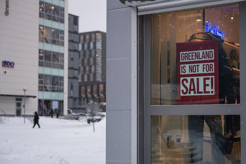A  sign reading 'Greenland is not for sale' hangs in the window of a Nuuk clothing shop. Photograph: Jonathan Nackstrand/AFP via Getty Images