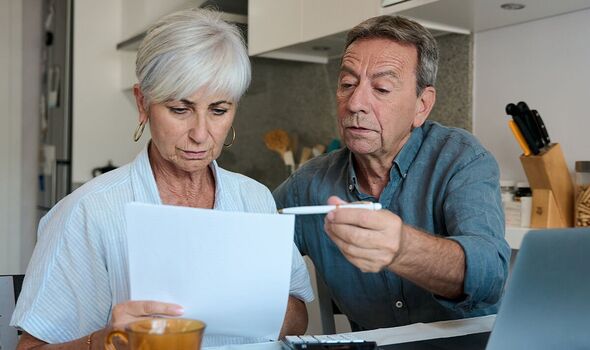 A couple check their finances A couple check their finances