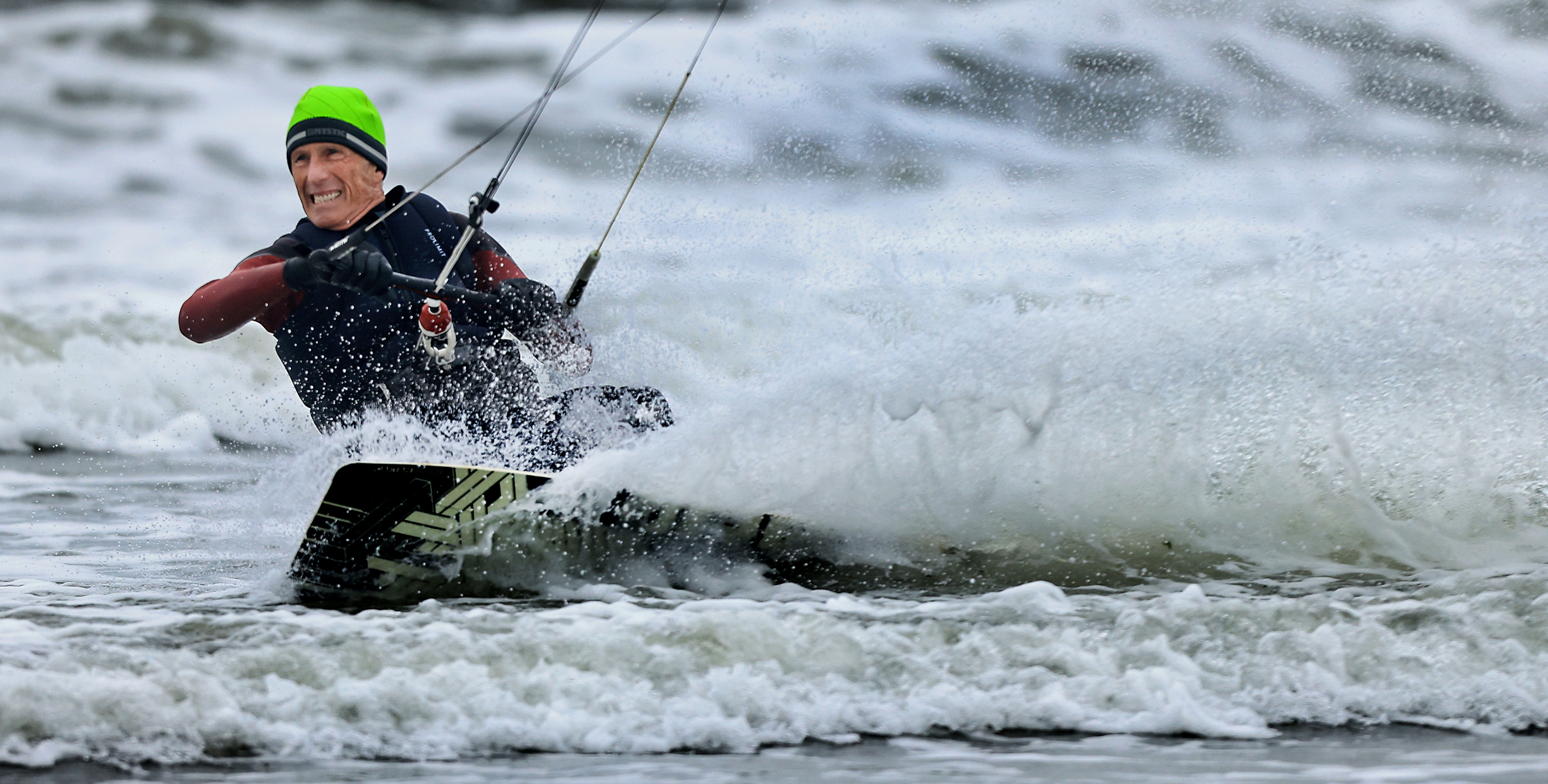 Sam Geller, 70, of Santa Rosa, kite surfs at Doran...