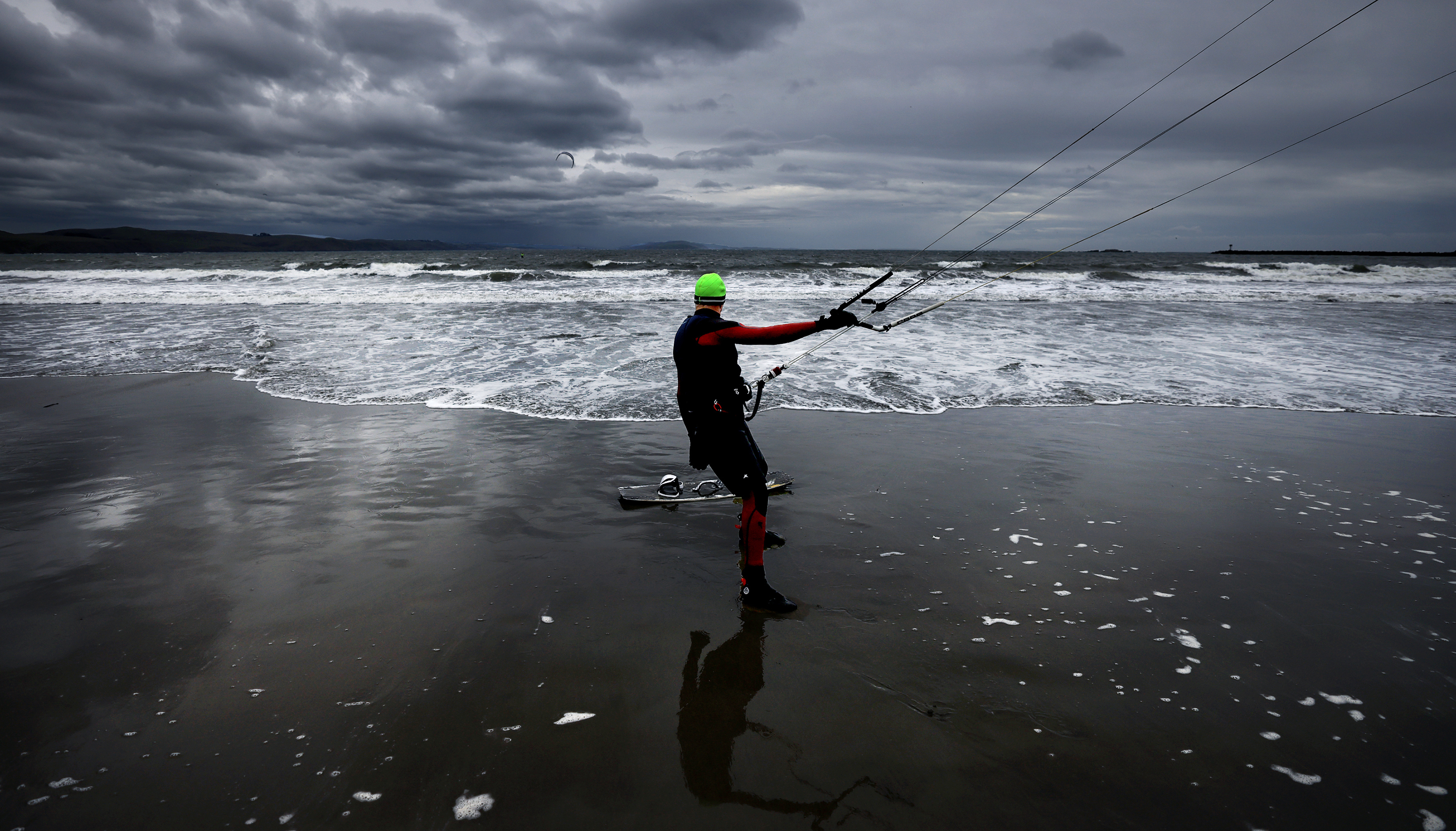 Sam Geller, 70, prepares to kite surf during an incoming...