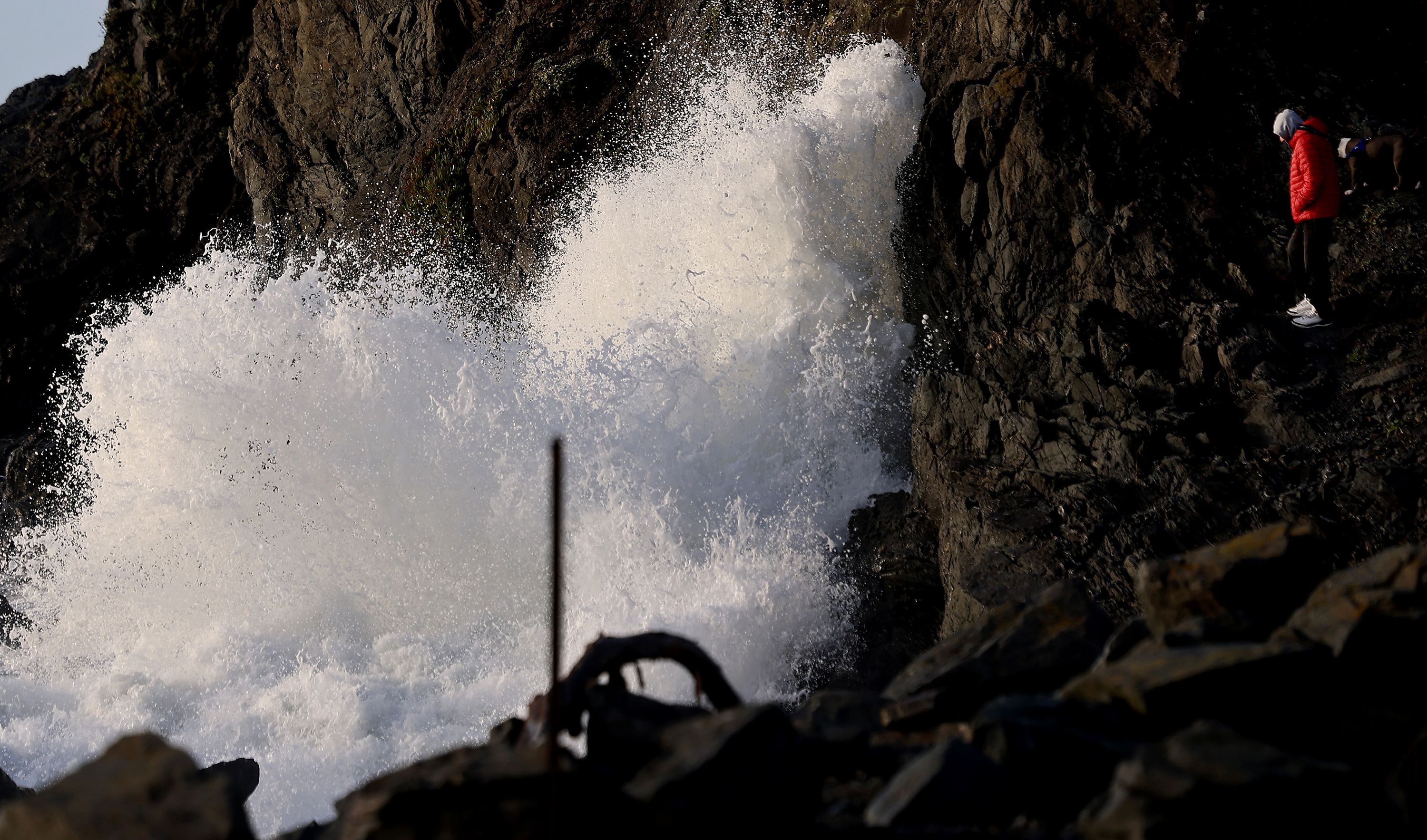A wave crashes against Goat Rock during the second day...