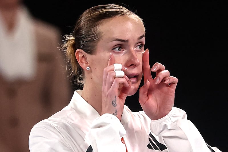 Elina Svitolina wipes her tears as she speaks with media after her win over Coco Gauff. Photograph: Izhar Khan / AFP via Getty Images
