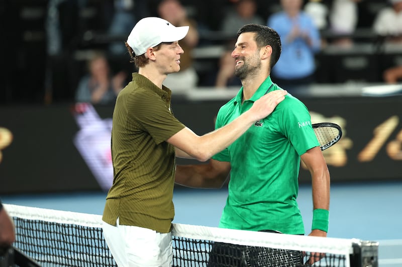 Serbia's Novak Djokovic embraces Italy's Jannik Sinner after their men's singles semi-final match. Photograph: Martin Keep/Getty
