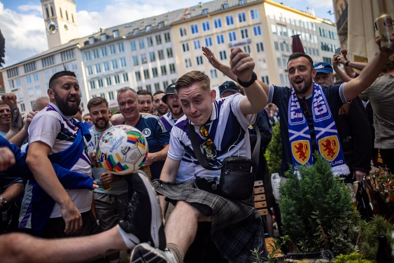 Scottish fans engage in revelry during Euro 2024 in Munich. Photograph: Martin Divisek/EPA