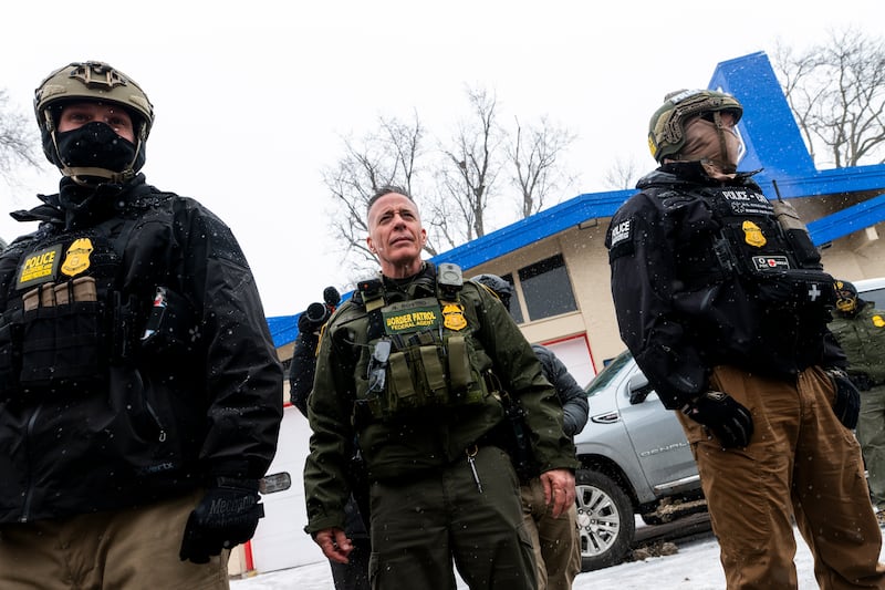 US Border Patrol Commander Gregory Bovino (C) looks on as he is confronted by community members on January 21, 2026 in Minneapolis, Minnesota. Photograph: Stephen Maturen/Getty Images
