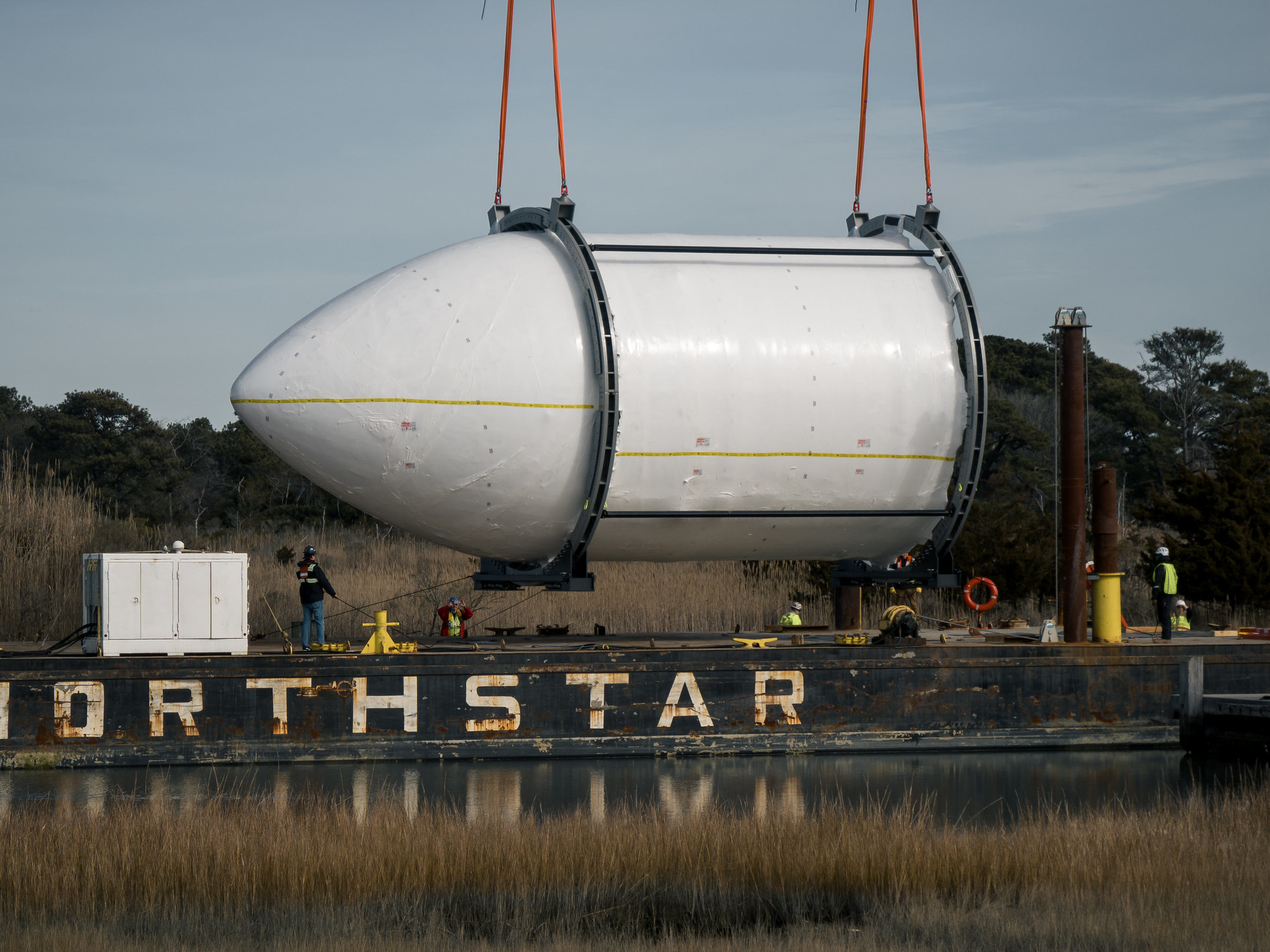 A rocket fairing is being transported