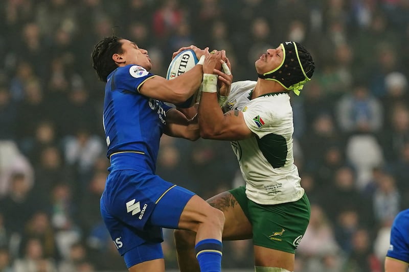 Ange Capuozzo of Italy in action under pressure of Edwill van der Merwe. Photograph: Federugby/Federugby via Getty
