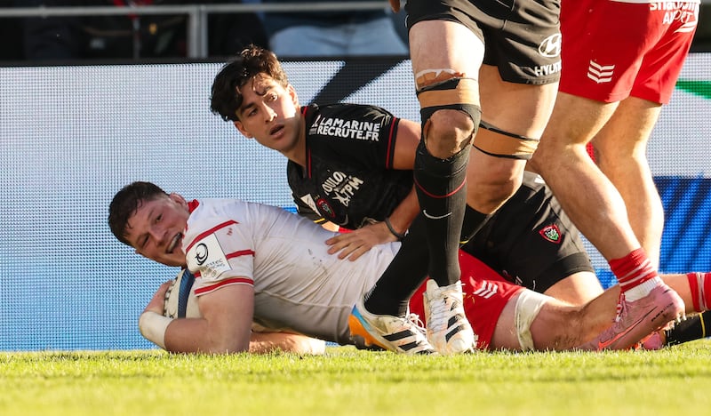 Munster's Jack O'Donoghue celebrates scoring against Toulon despite the best efforts of Marius Domon. Photograph: Billy Stickland/Inpho