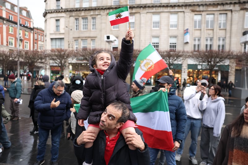 Arif Habibi holds up his daughter Selena (5) at the protest in Dublin. Photograph: Enda O’Dowd