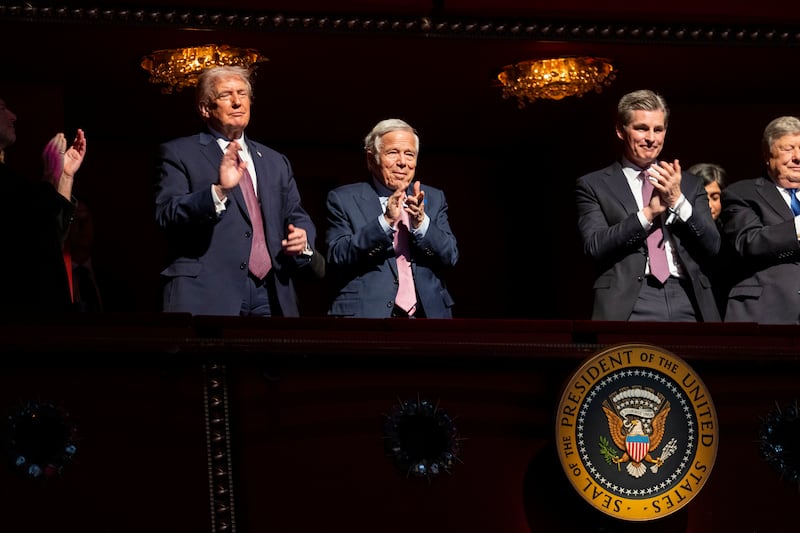 US president Donald Trump and New England Patriots owner Robert Kraft (centre) listen as first lady Melania Trump speaks before the premiere of her movie Melania. Photograph: Doug Mills/The New York Times                     