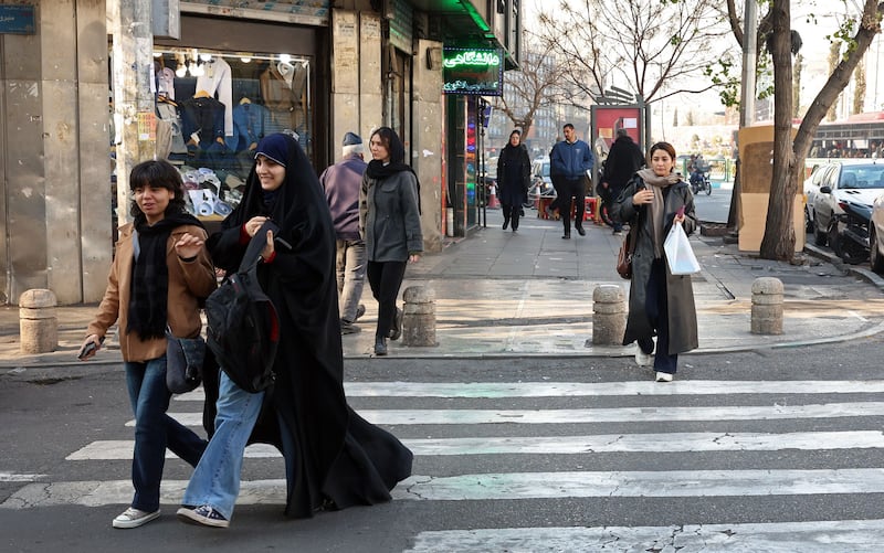 People walk along a street in Tehran, Iran, on Tuesday. Photograph: Abedin Taherkenareh/EPA