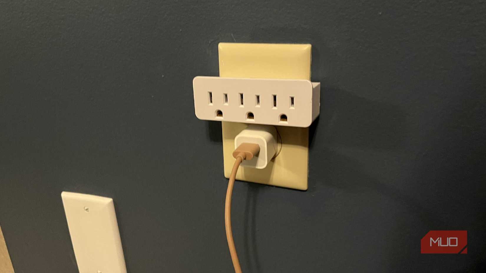A 3-outlet grounded AC/DC adapter in an outlet