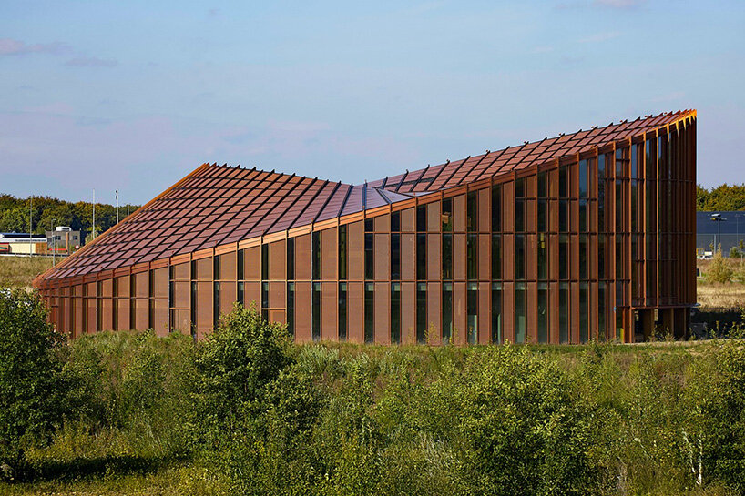 watch: ballet dancers take over BIG's circular timber building of dymak HQ in denmark
