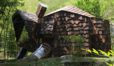 bamboo-clad guest room stretches like a cat in chinese forest
