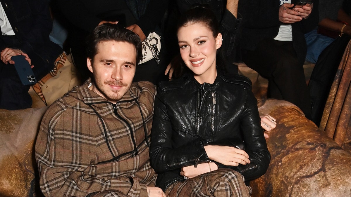 Brooklyn Beckham and his wife Nicola at a Burberry event