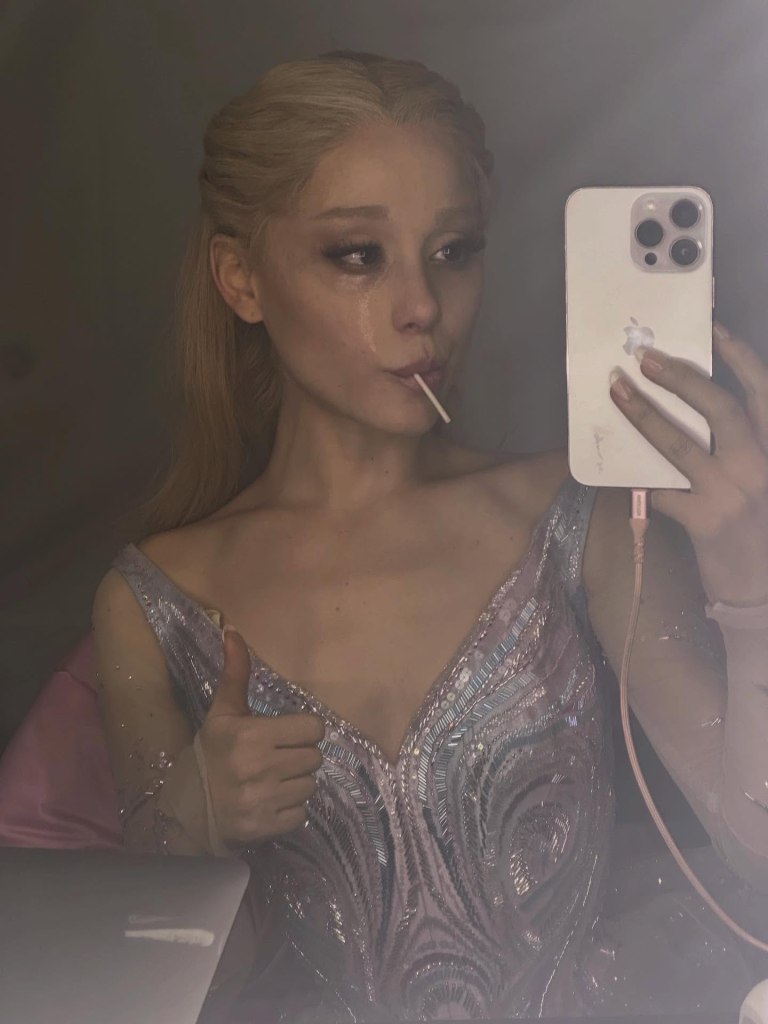 Ariana Grande shows a teary eyed Glinda selfie.