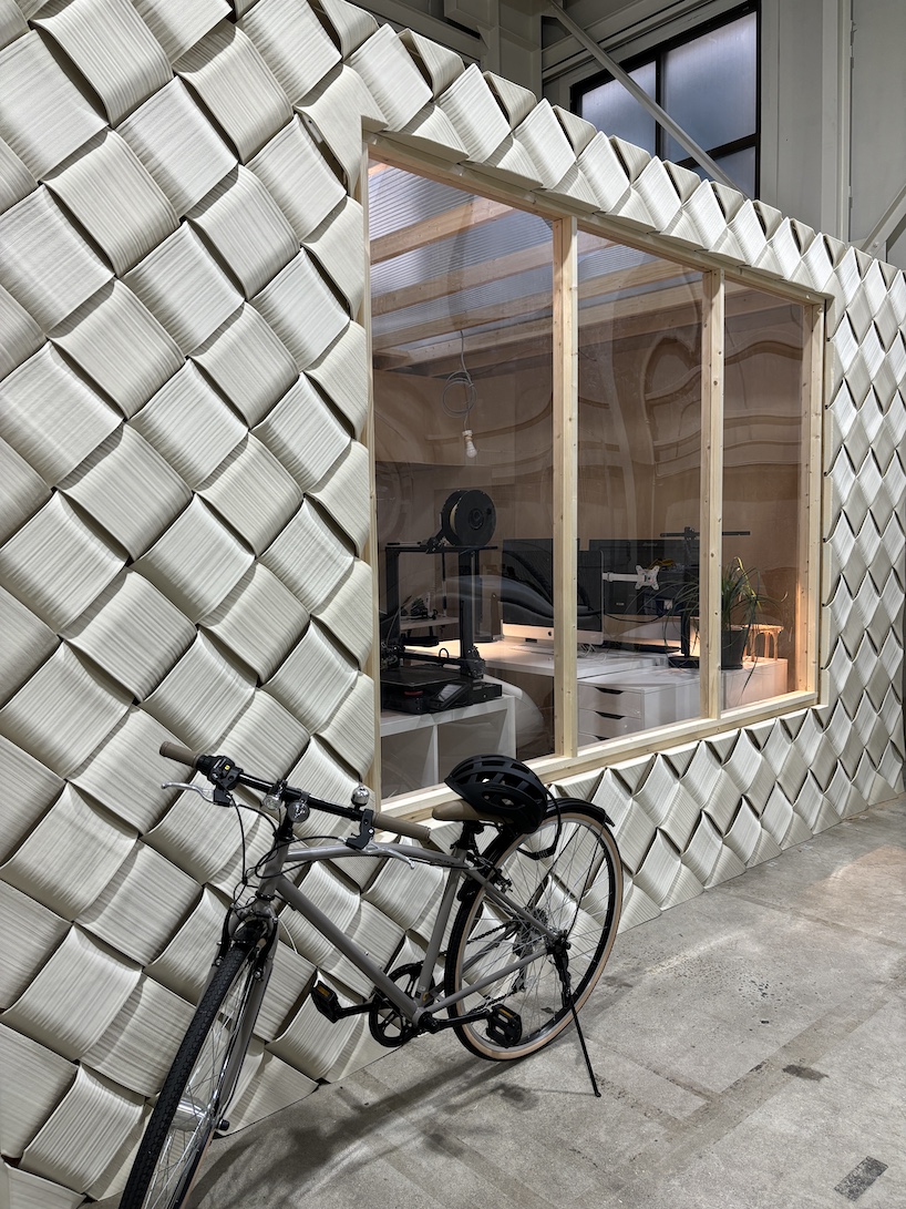 modular 3D printed facade wraps workspace in japan like knit textile