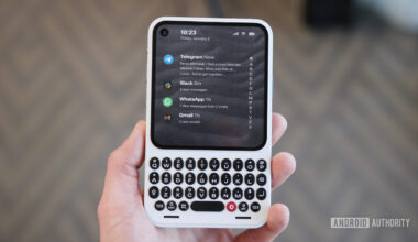 Holding the Clicks Communicator.