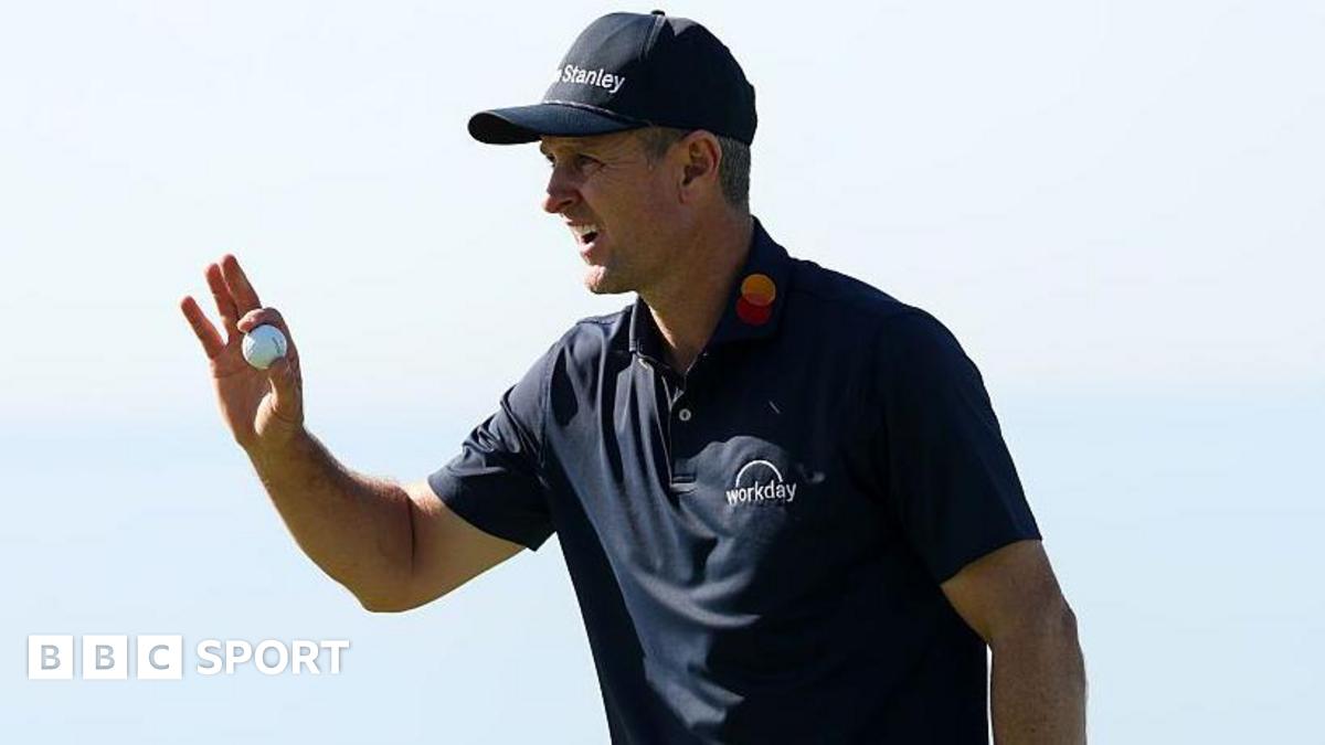 Justin Rose picks up his ball