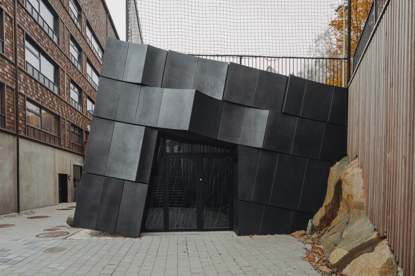Exterior view of cavern entrance by Erdegard Arkitekter