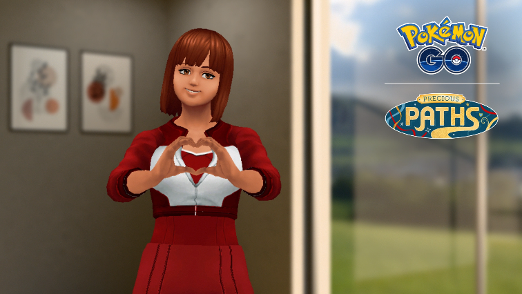 A Pokémon Go trainer makes a heart shape with her hands