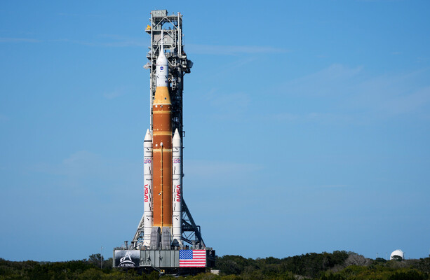 Rocket for Nasa's first crewed mission to the moon since the 1970s arrives at launch pad
