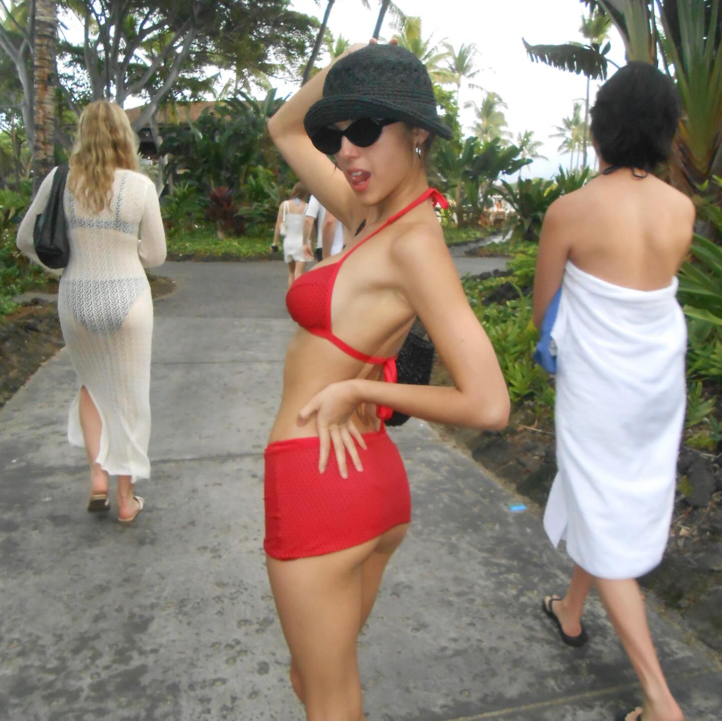 Olivia Rodrigo dons a red swimsuit set while celebrating 2026.