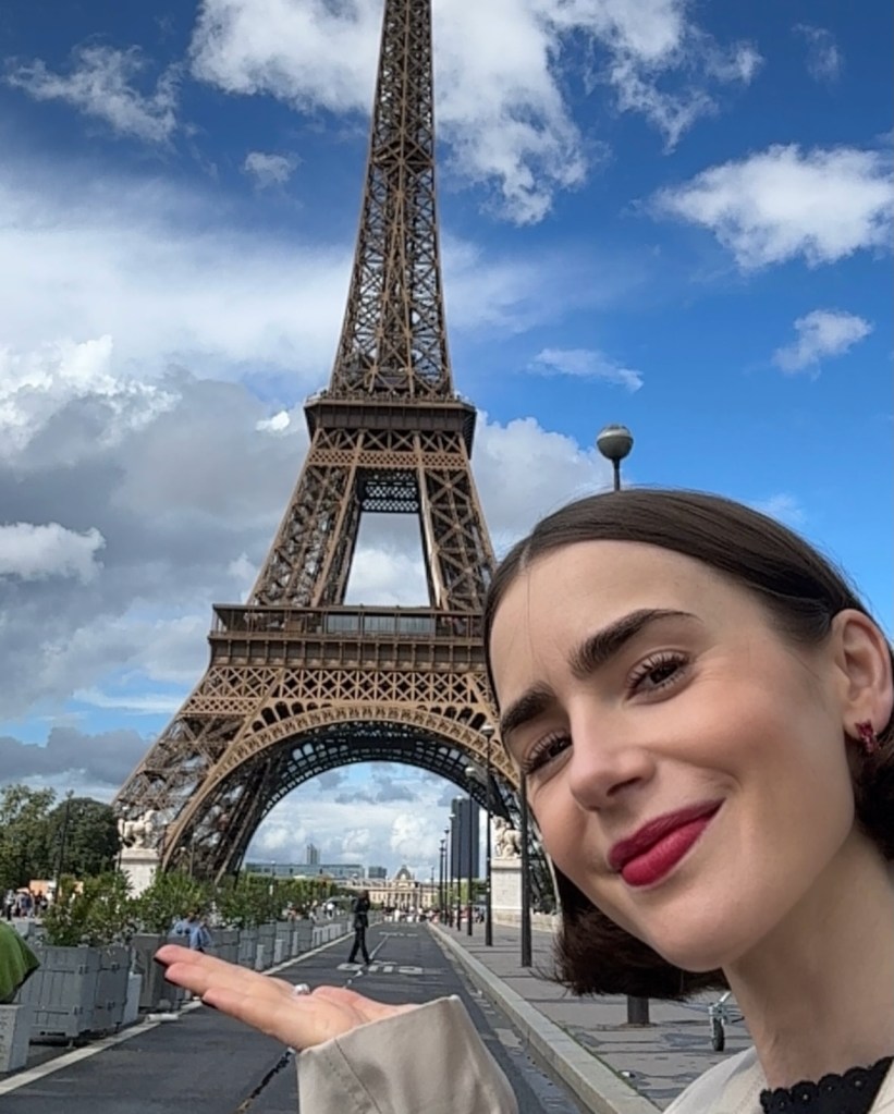 Lily Collins poses with the Eiffel Tower while announcing "Emily in Paris'" season 6 return.