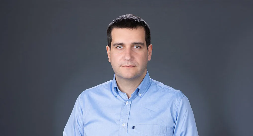 Dr. Aristeidis G. Telonis in light blue collared shirt