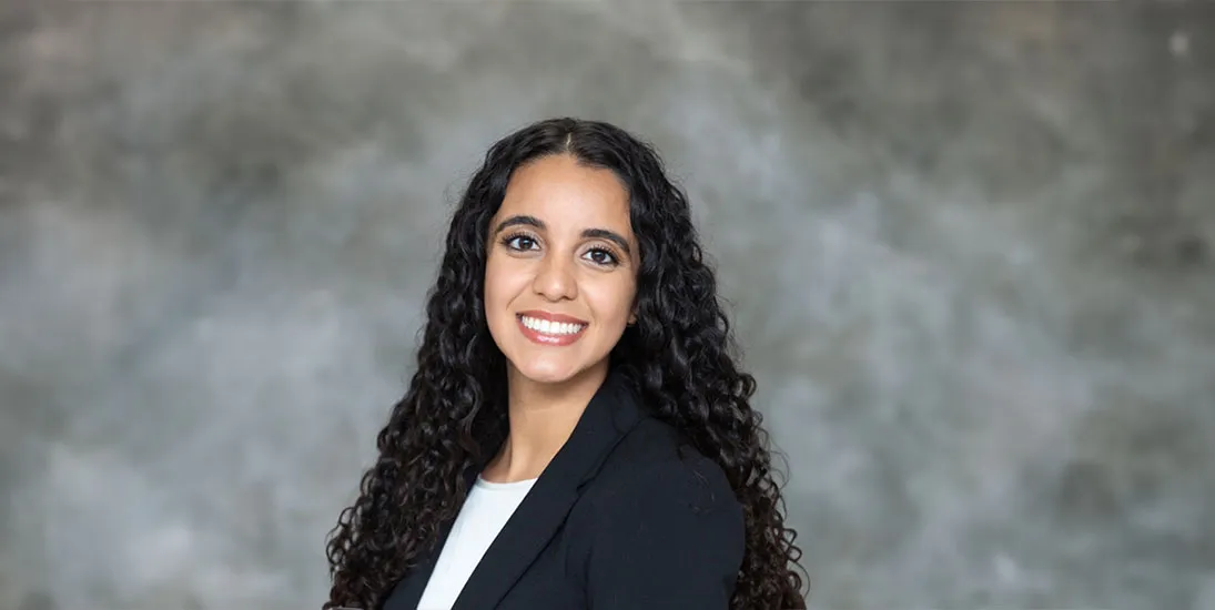 Dr. Stephanie Ioannou, in dark jacket and white shirt