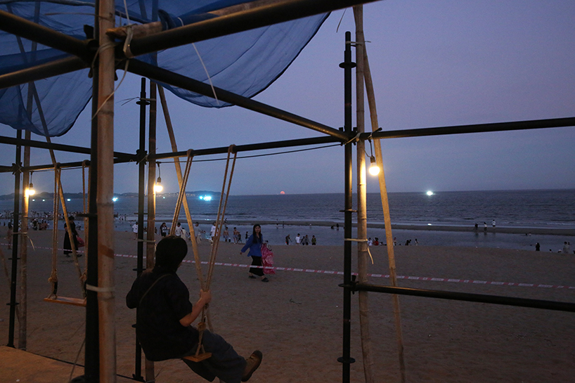 traditional bamboo scaffolding constructs temporary theater along chinese coast