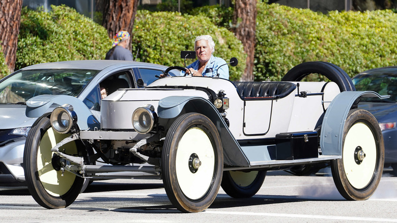 Jay Leno driving a classic car