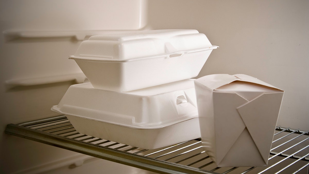 While takeout containers seen in fridge