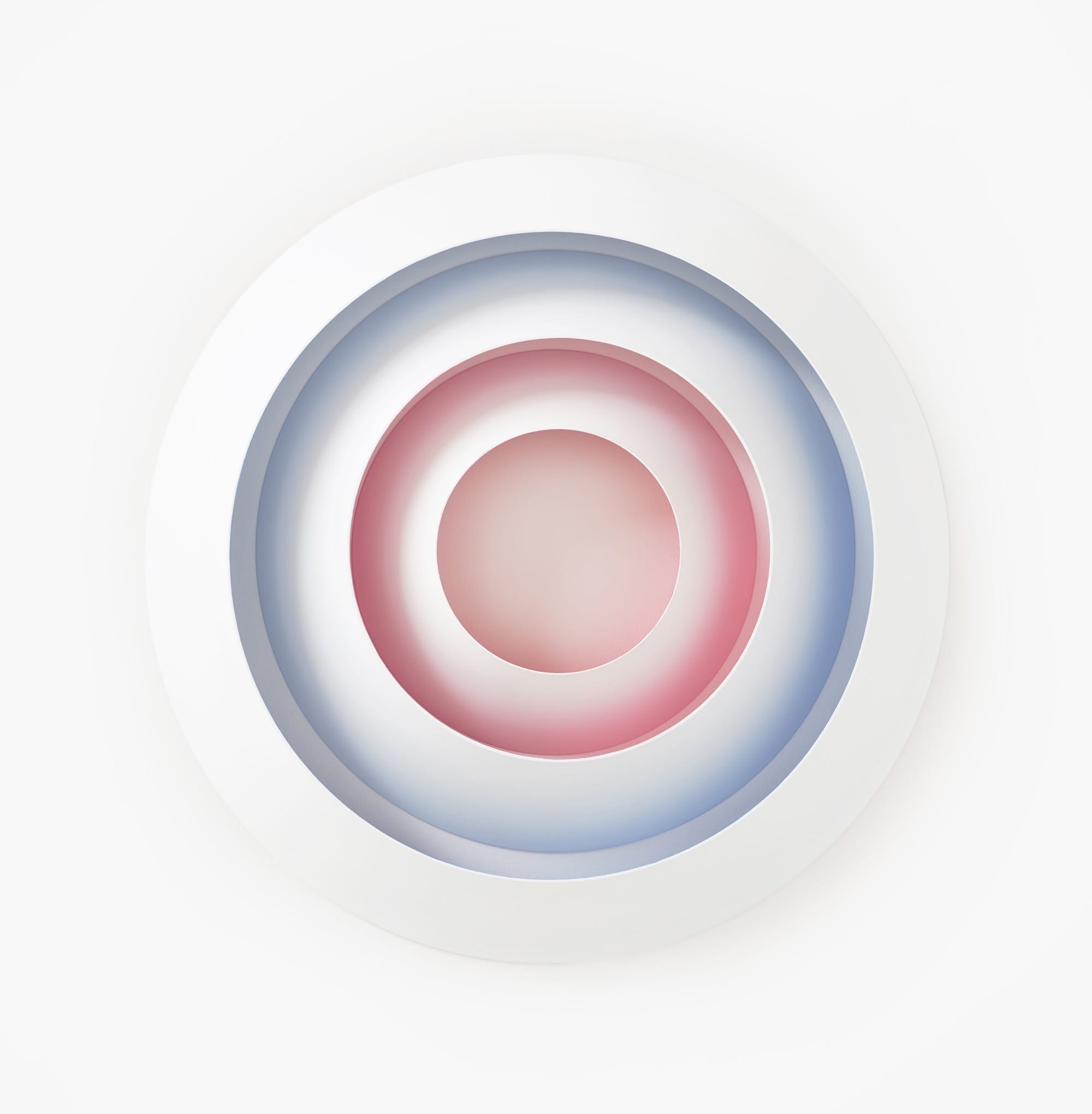 a sculpture by Luftwerk with white concentric rings that glow in blue and pink from the underside