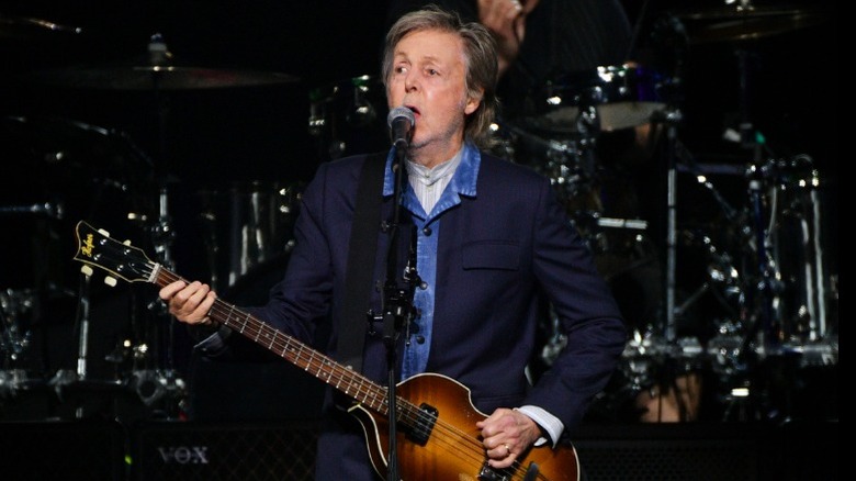 Paul McCartney performing at the O2 arena