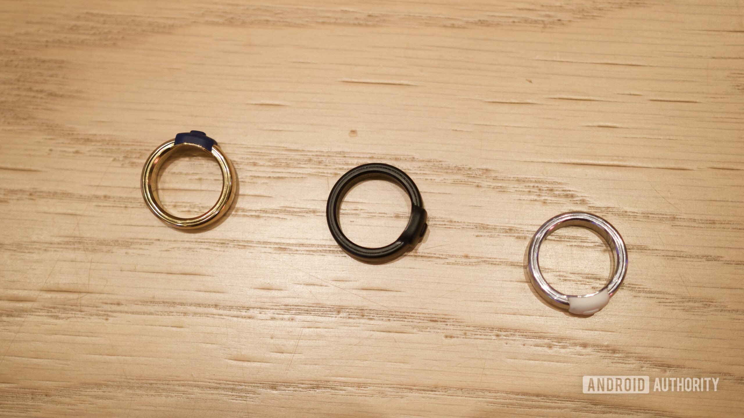 Three Pebble Index 01 rings laying on a table.