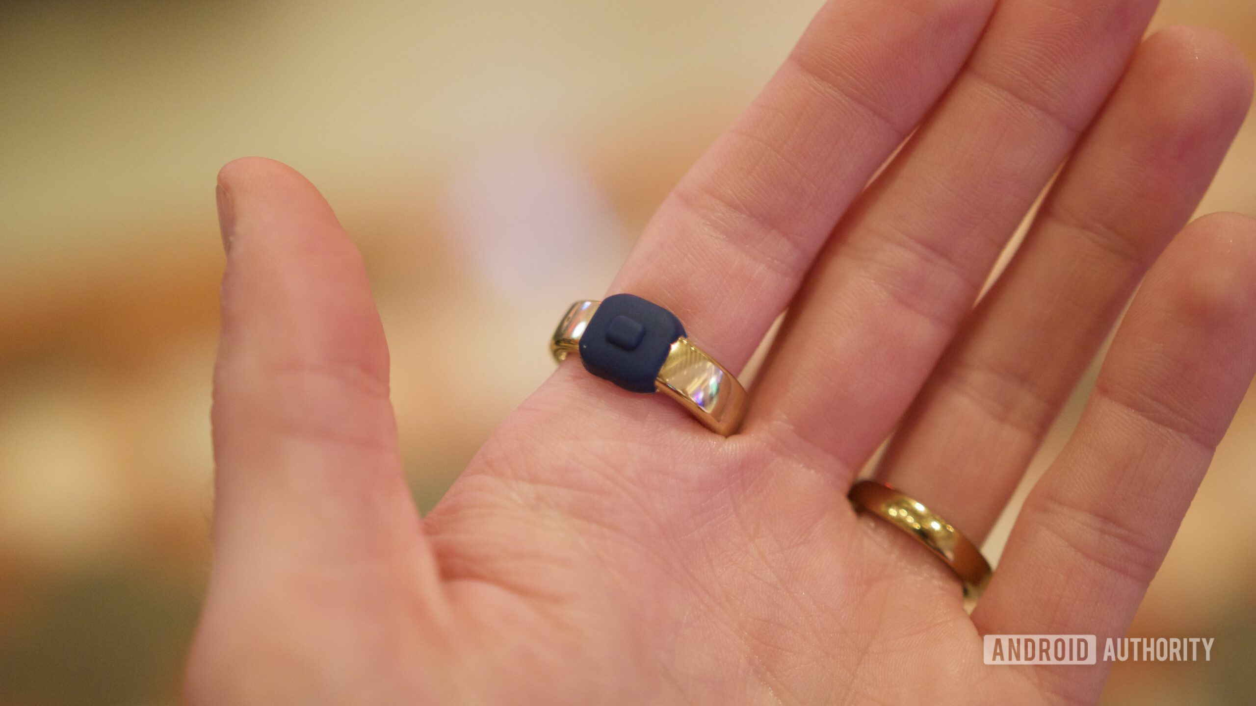 Someone wearing the Pebble Index 01 ring, showing the button.