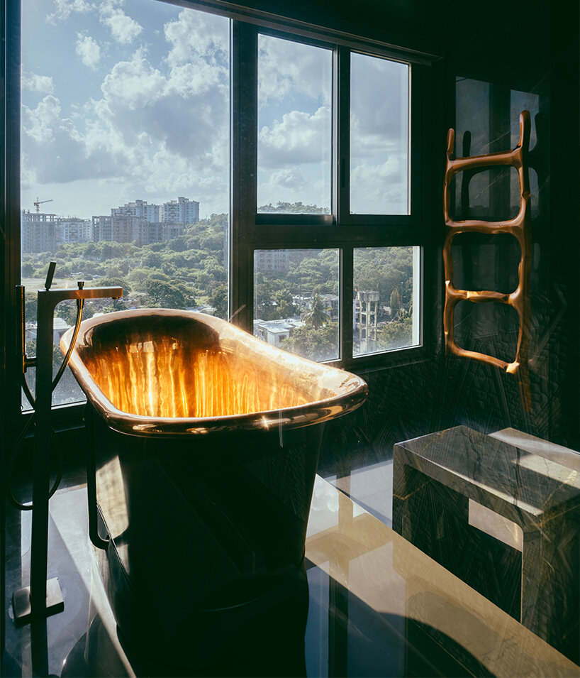 penthouse residence by metaphors blends neo-classical detail with brutalist geometry