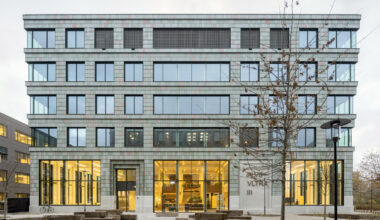 Building clad in plastic tiles