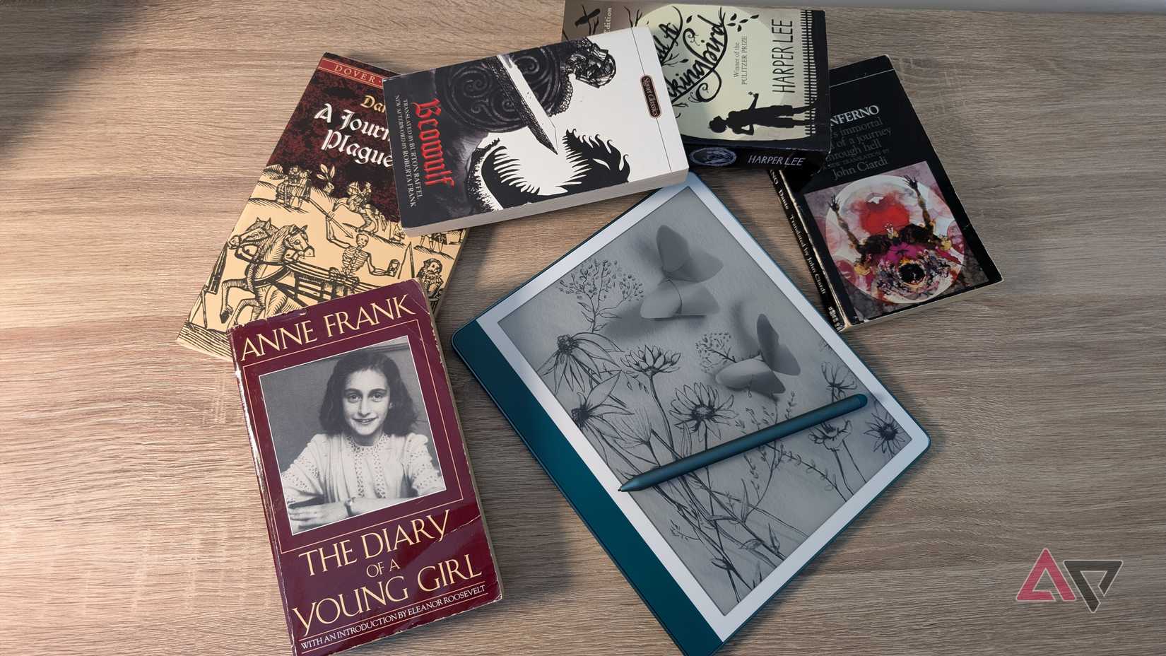 The emerald Kindle Scribe (2024) surrounded by classic literature