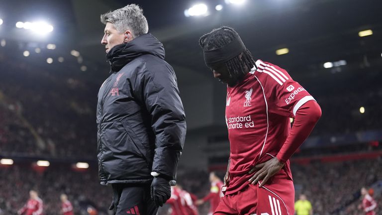 Liverpool's Jeremie Frimpong goes off injured early in the first half