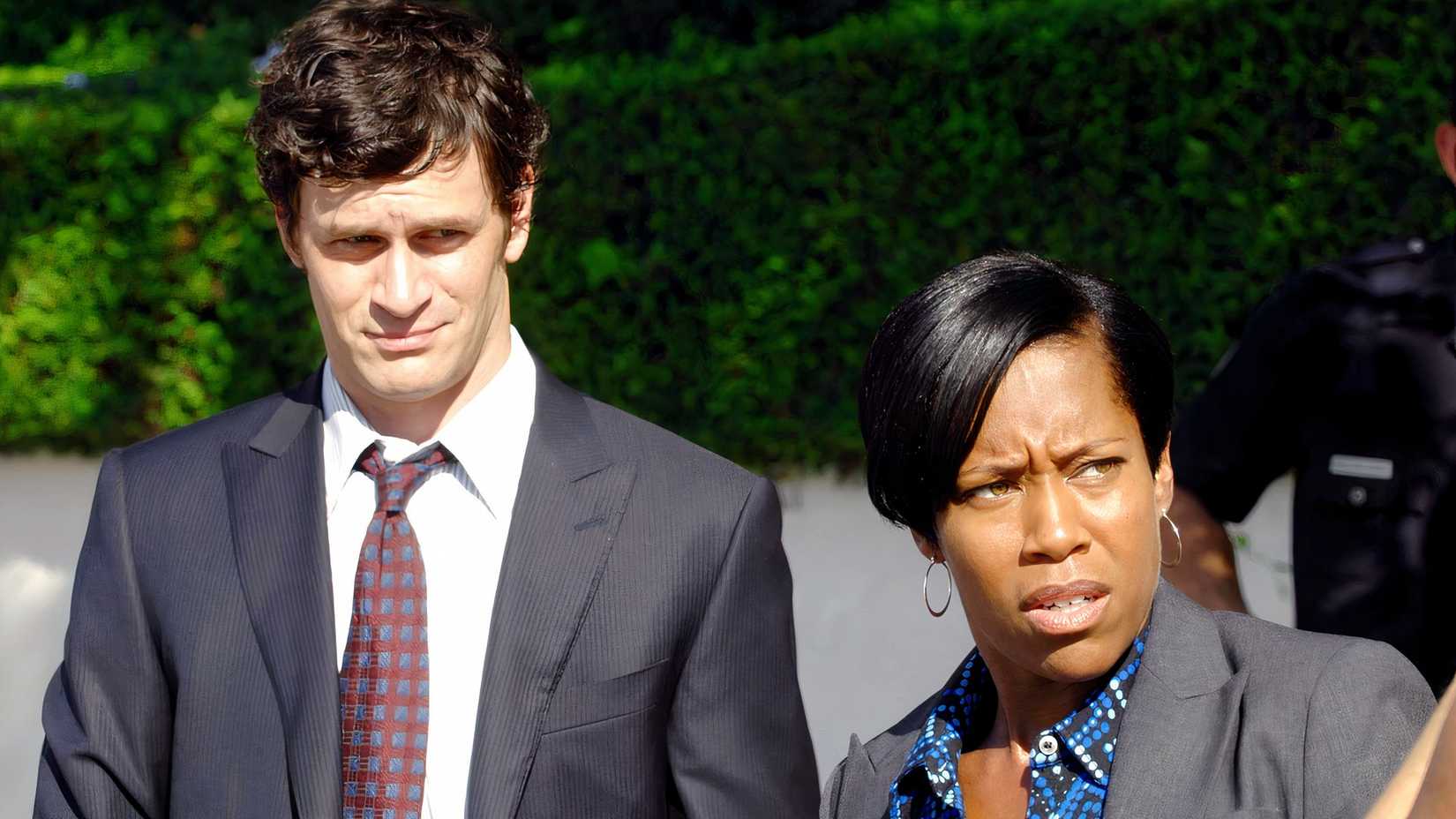 Regina King and Tom Everett Scott as cops in Southland.